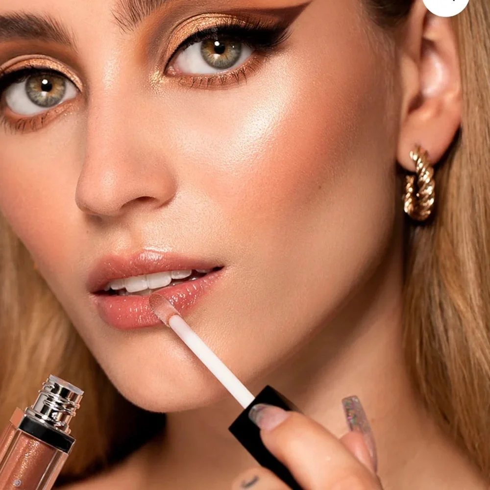 Sigma Lip Gloss in Idyllic a tawny copper shimmer high shine, not sticky